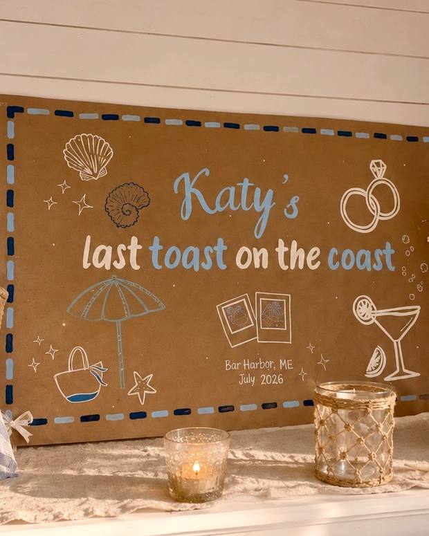 Hand-painted bachelorette sign reading Katy's last toast on the coast